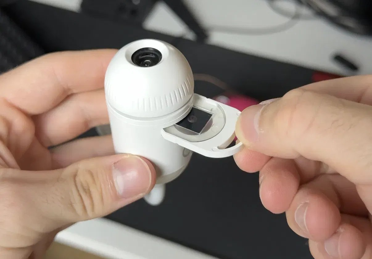 A hand inserting a slide into the GALIX projector
